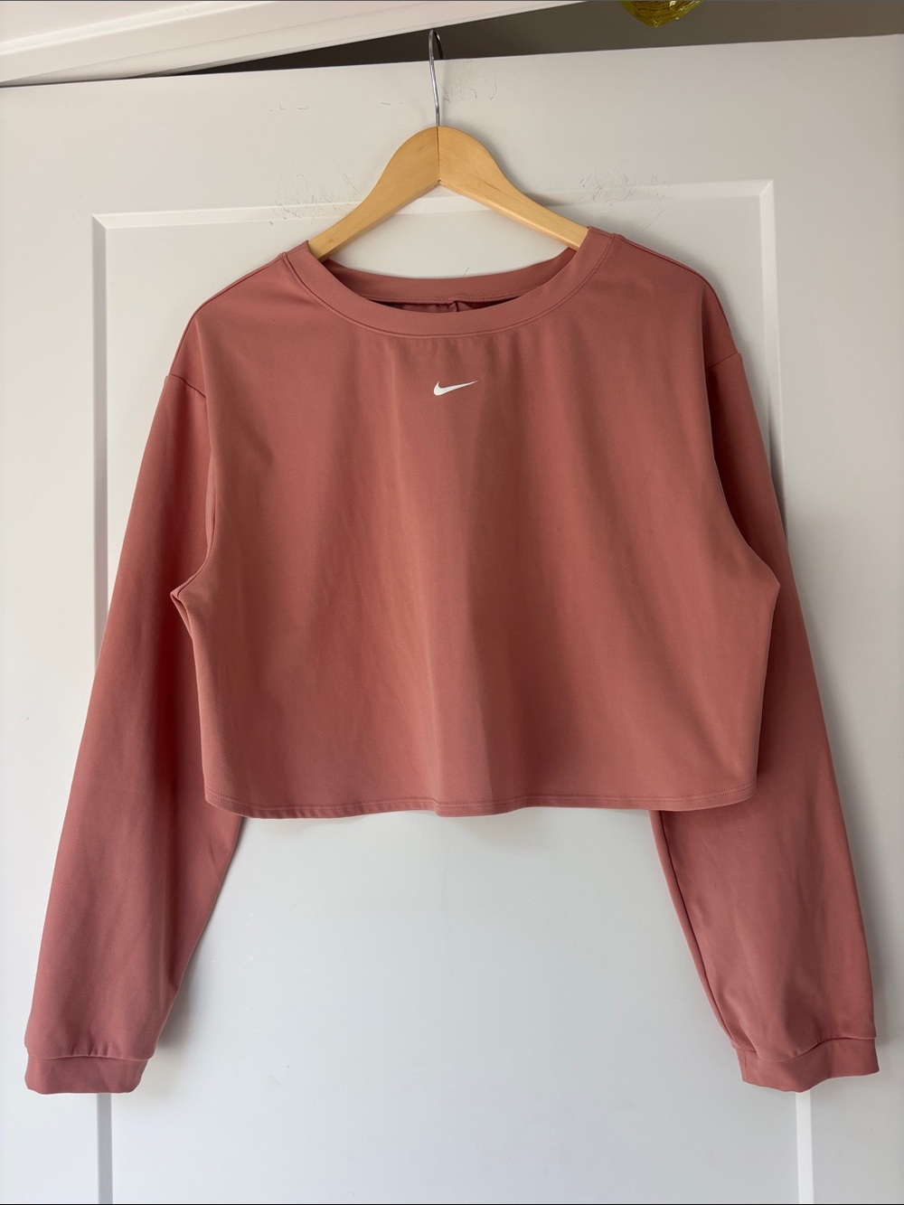 Nike One Dri-FIT Pink Open Back Cropped Long Sleeve Top in Dusty Pink
